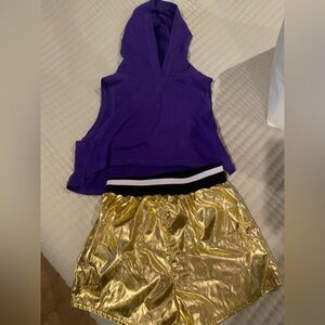 Purple Sleeveless Hoodie Top and gold shorts